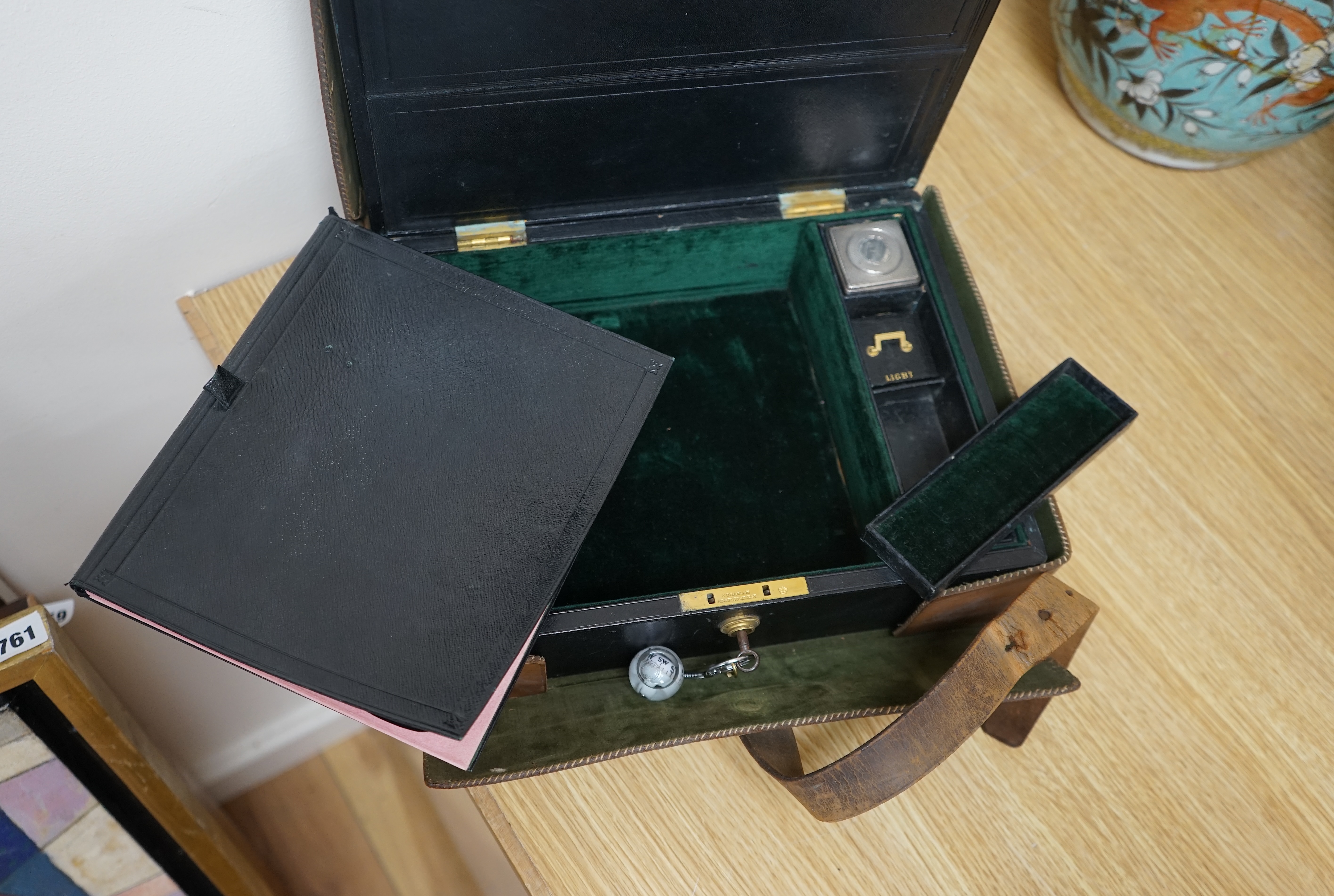 Wells & Lambert, London, a travelling writing box and outer leather case, with Bramah lock and keys, with monograms and inscriptions of Rev. George A. Robins, the box incorporating a silver lidded inkwell, 33cm wide. Con